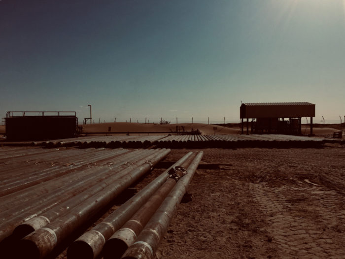 oil pipes laying on the ground