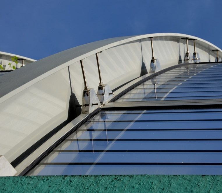 curved roof with cambered steel beams